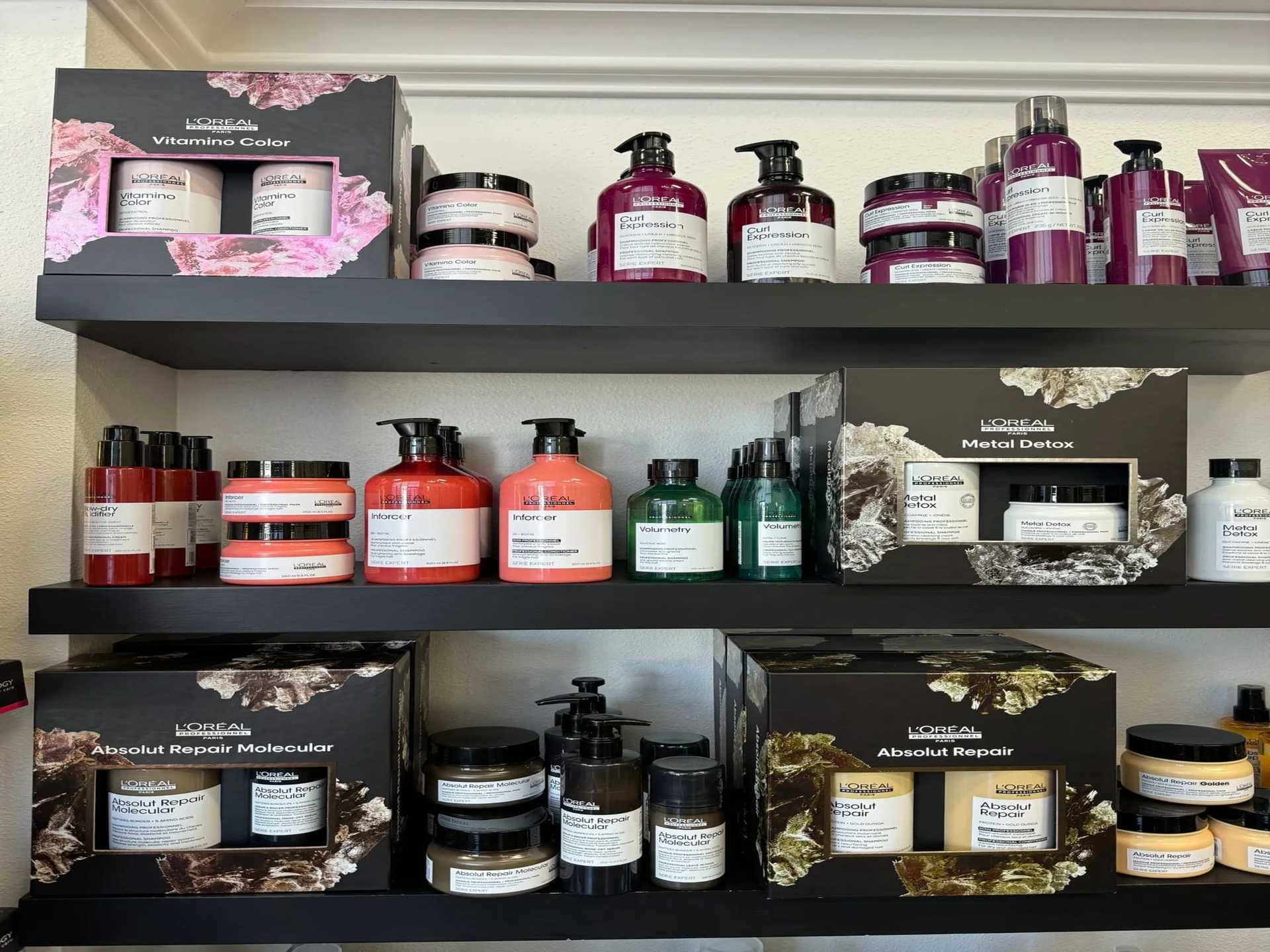 Shelves displaying various hair care products and treatments in bottles and jars.